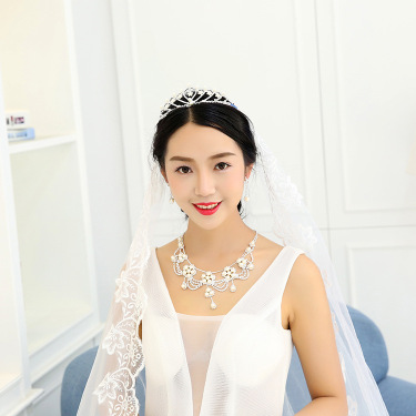 Bridal pearl necklace, earring, two piece wedding dress, chain photo studio and accessories—2