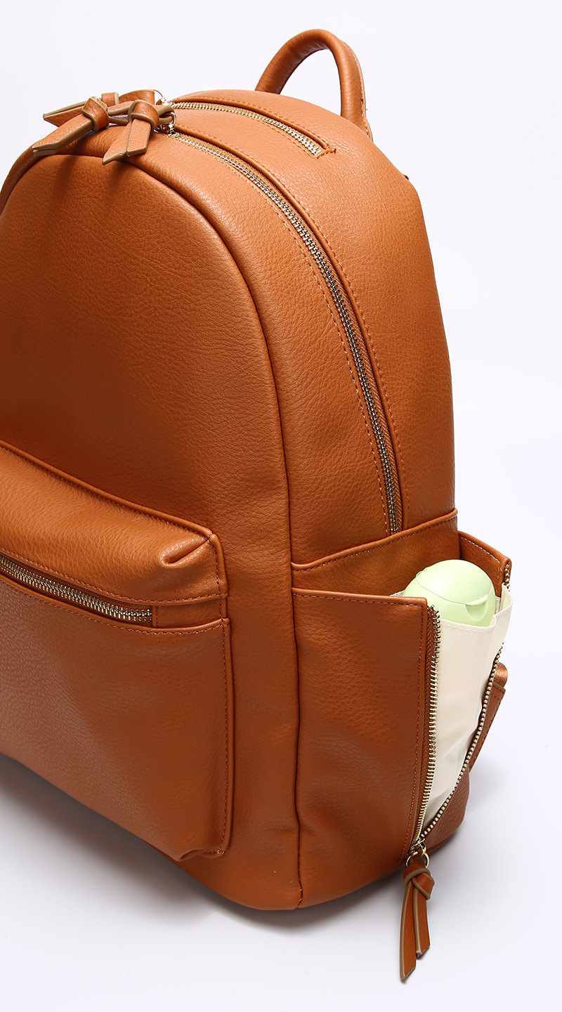 The Compact Vegan Leather Backpack From Side View