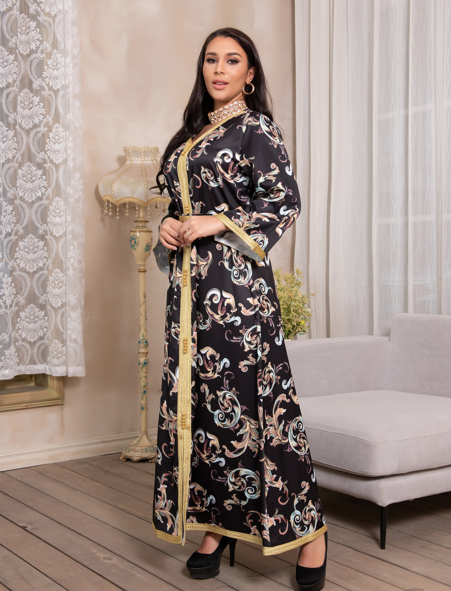 a woman wearing new dubai printed long belt dress full length view