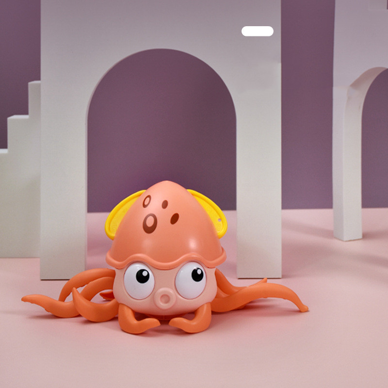 "Child happily playing with Octopus Bath Toy"