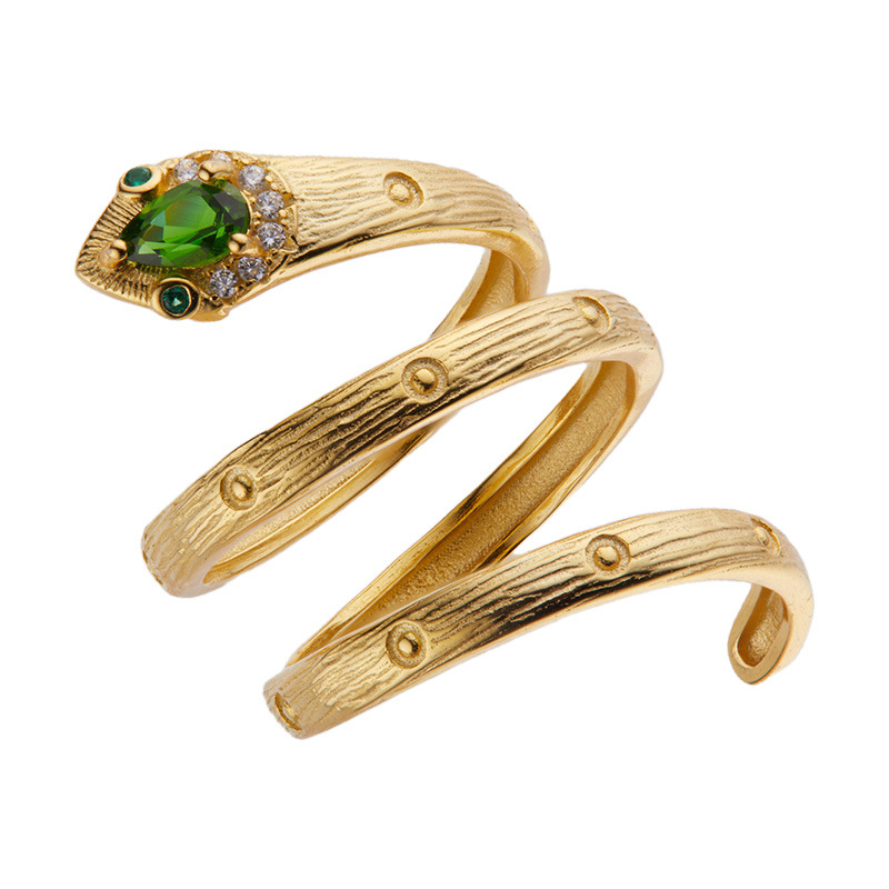 "Close-up of a gold-colored ring with a green stone"