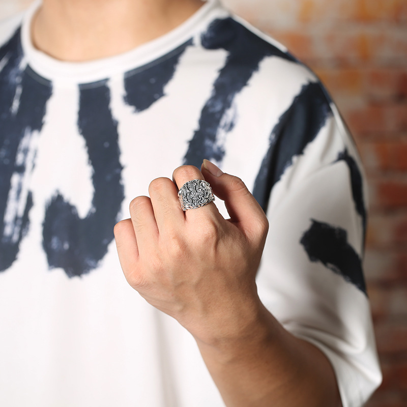 Man wearing Men's Silver Cross Ring on finger