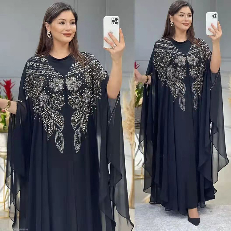 double view of a woman wearing a black arabian robe plus size long dress gown full length and partial length and holding a phone