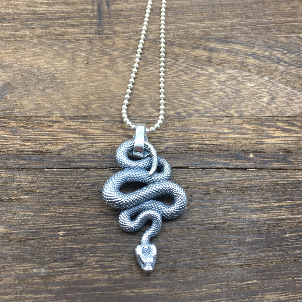 "Unique Python Element on Mens Silver Pendant"