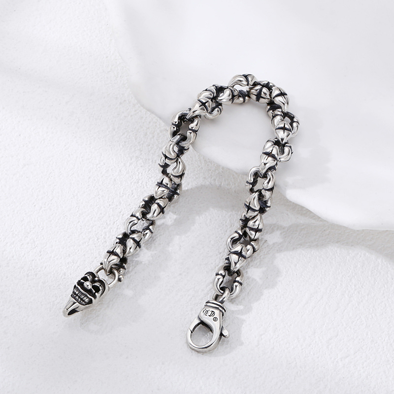Close-up of the silver bracelet with skull design