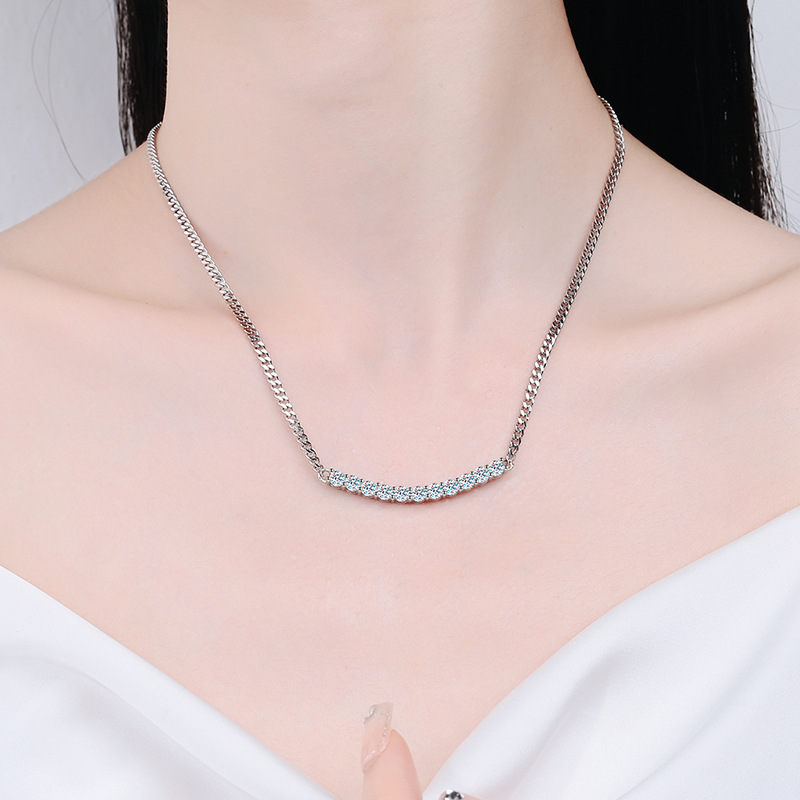 A woman wearing a silver necklace