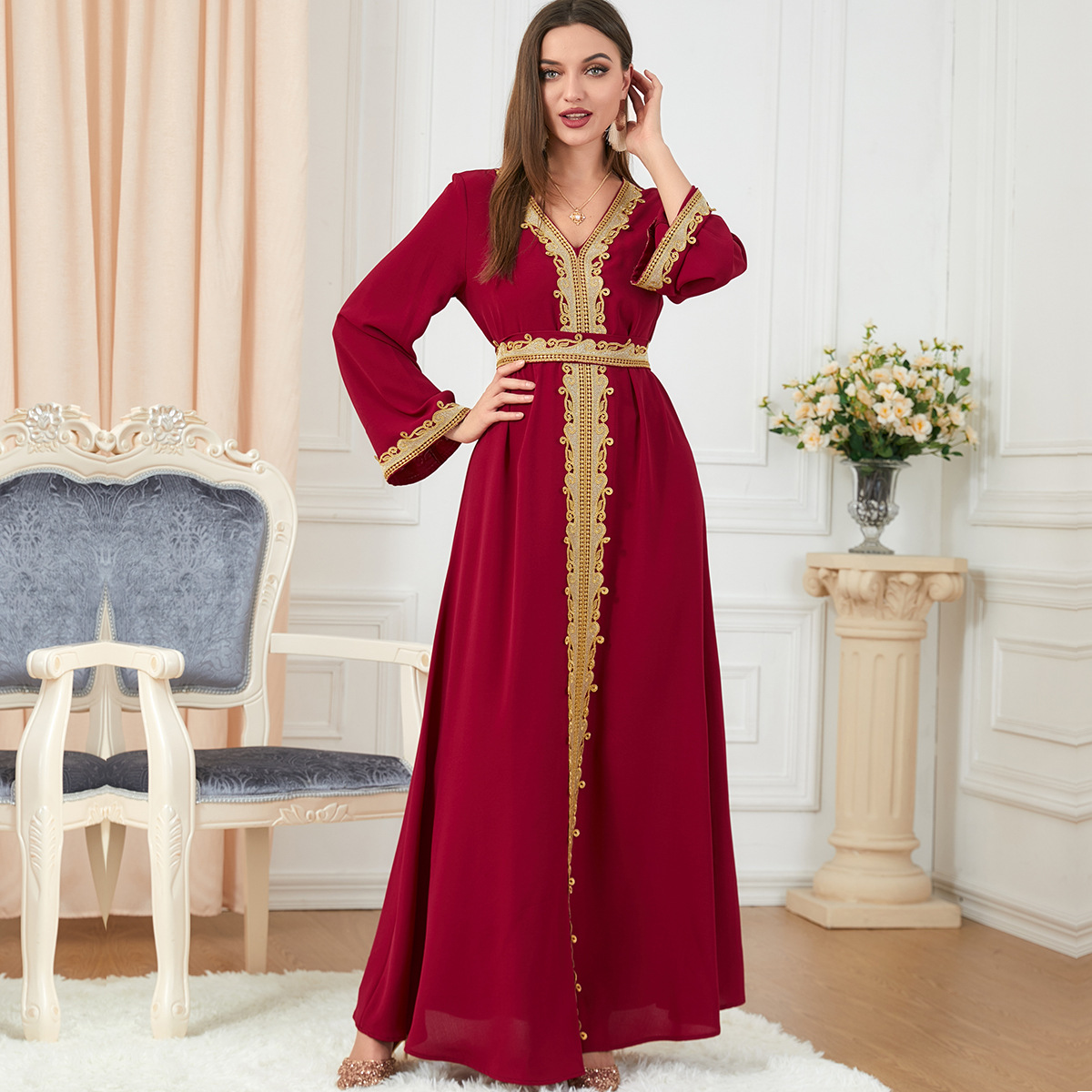 a woman wering solid color embroidery long-sleeved dress full length views