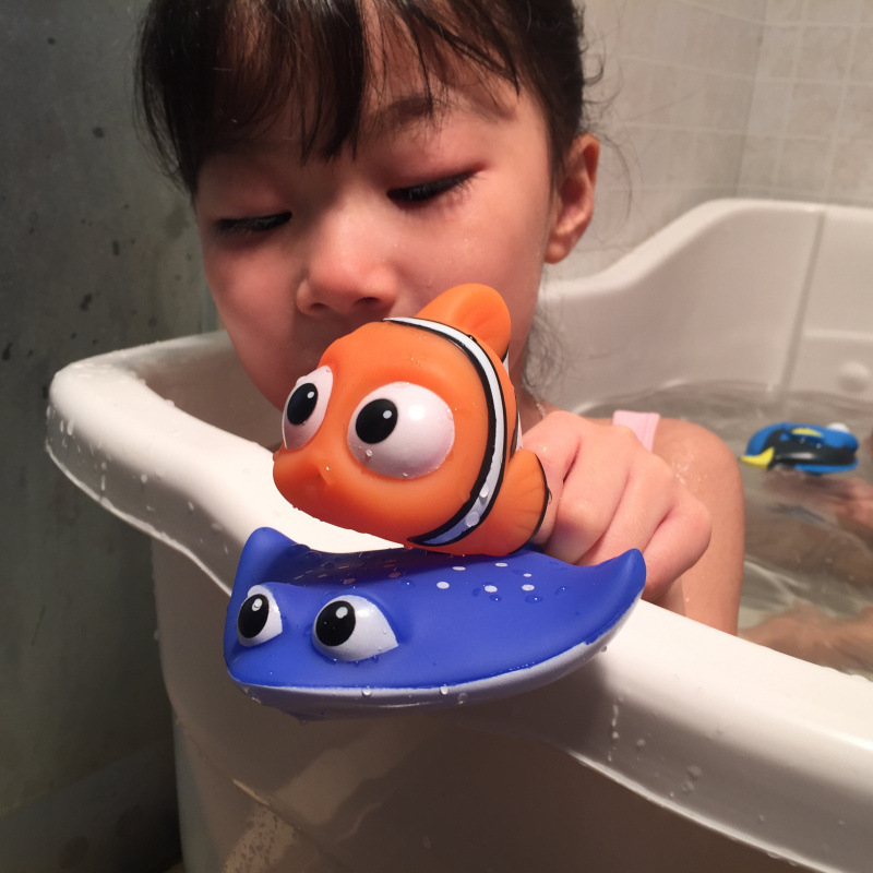 Child holding a durable and safe bathtub toys