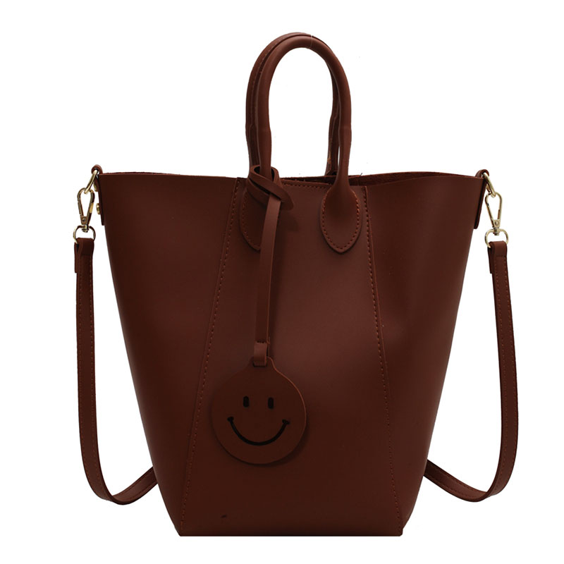 dc64a60e 5c1a 4e75 9a42 1071fce90a24 - Solid Color Tote Bag With Smiley Face Pendant And Mother-In-Law Shoulder Bag