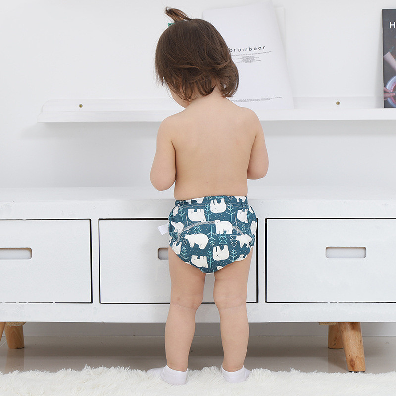 "Happy child learning to use potty with training pants"