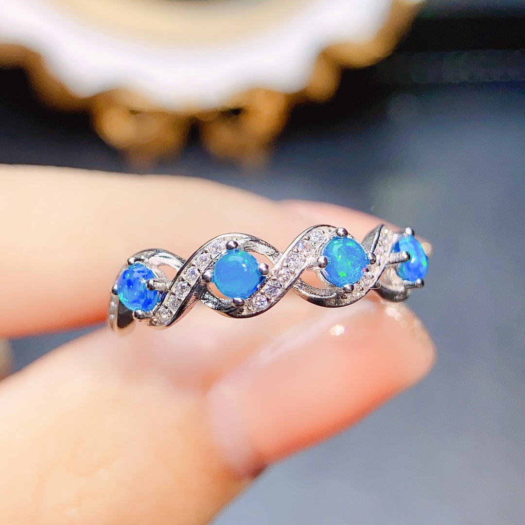 Close-up view of a ring embellished with blue opal