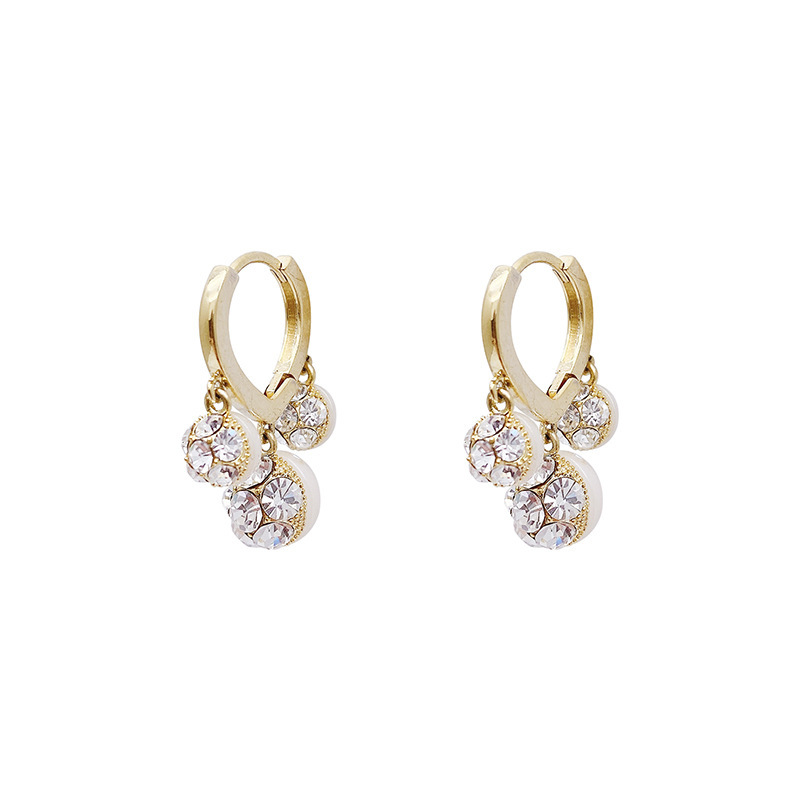 diamond-studded pearl earrings