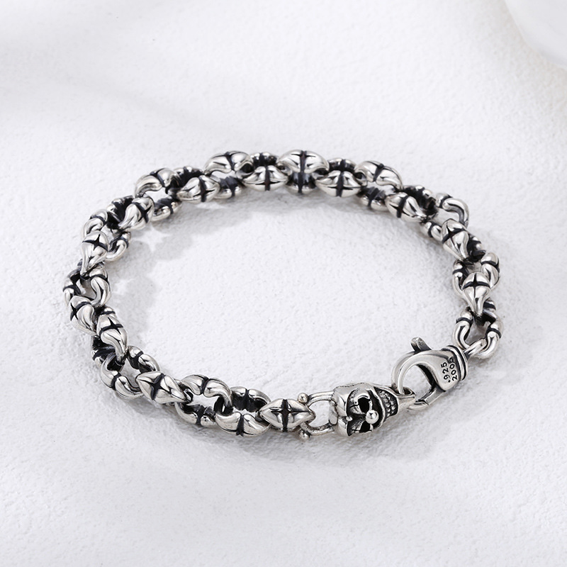 Men's S925 Silver Bracelet with Thick Skull design on a display stand